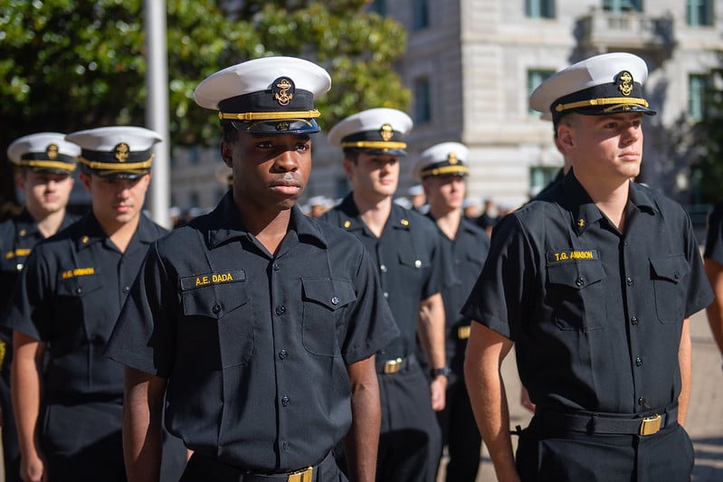 Midshipmen in blue service uniform.